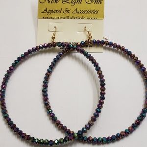Earrings by: New light ink apparel and accessories